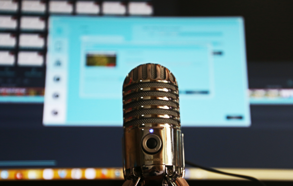 A recording microphone in front of computer recording software