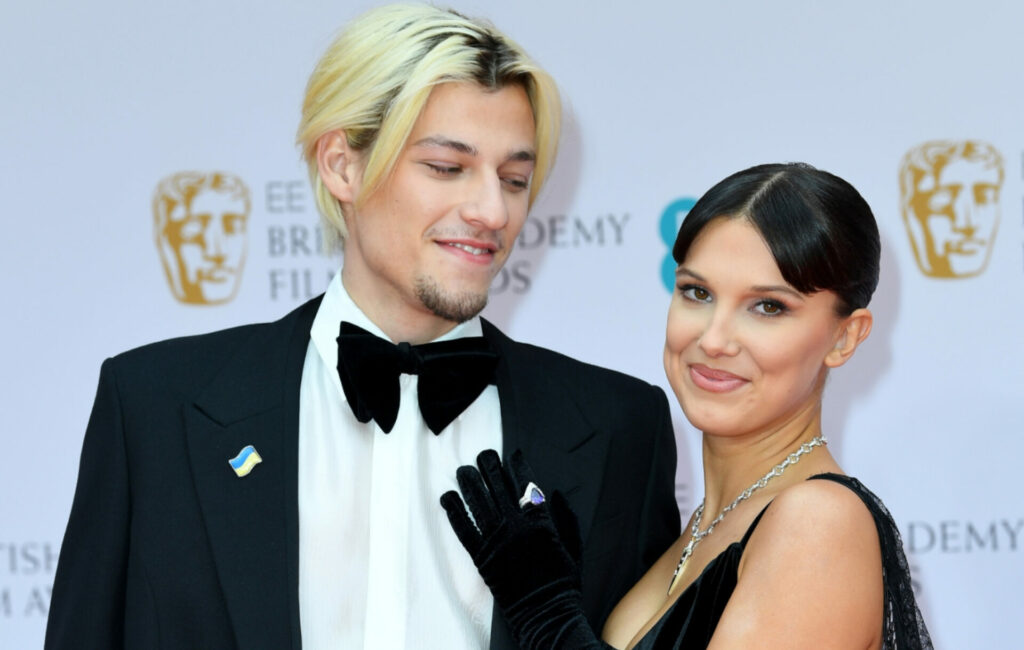 Jake Bongiovi and Millie Bobby Brown attend the EE British Academy Film Awards 2022 at Royal Albert Hall on March 13, 2022 in London