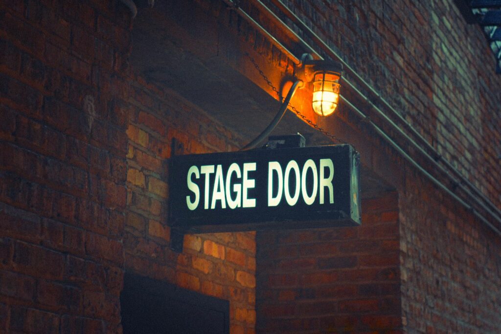 Stock photo of a stage door sign