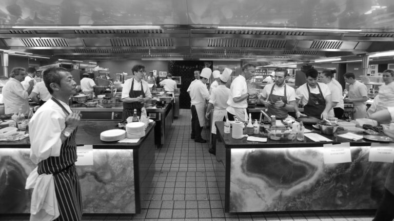Black and white image of chefs in a kitchen