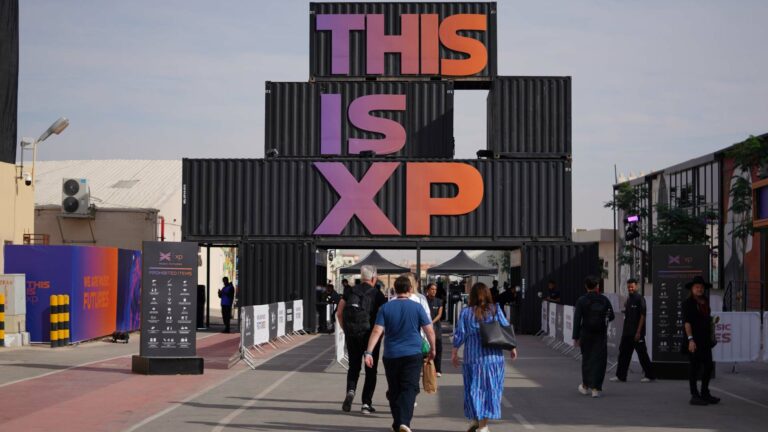 The entrance to a festival with a sign saying This is XP