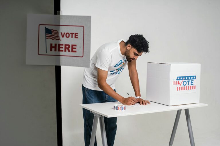 A man writing on a table