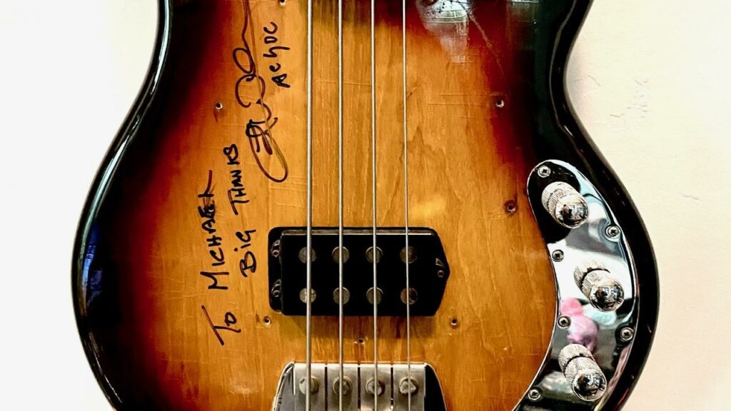 Close crop of a signed guitar