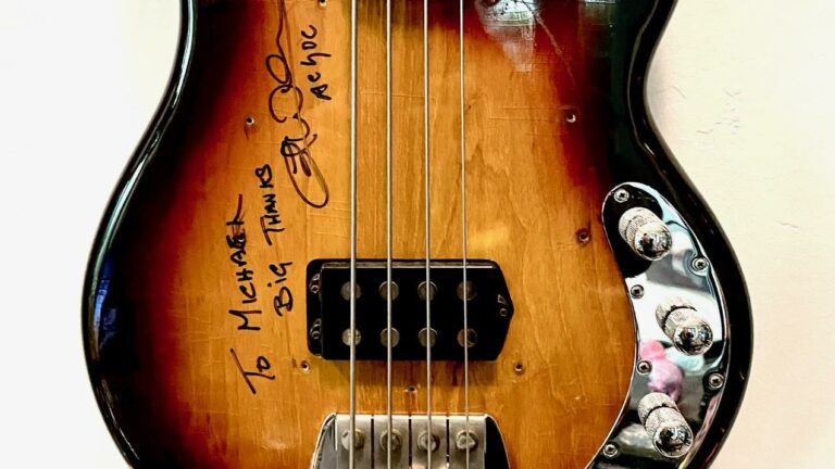 Close crop of a signed guitar